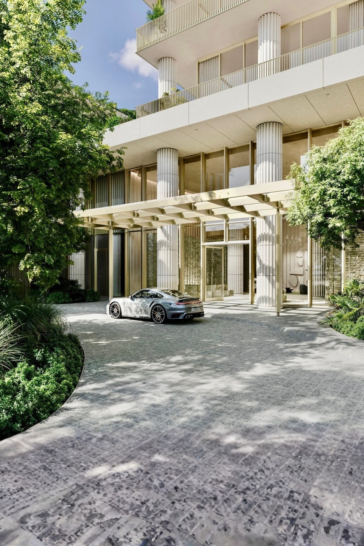 Street view of luxury architecture surrounding a Miami Design District condo location.