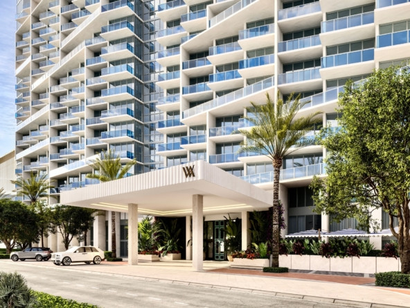 Oceanfront view of a South Beach luxury hotel along the coastline in Miami Beach during golden hour daylight.