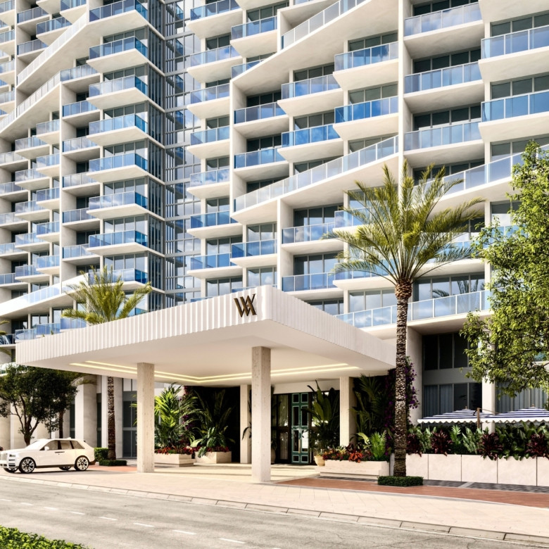 Oceanfront view of a South Beach luxury hotel along the coastline in Miami Beach during golden hour daylight.