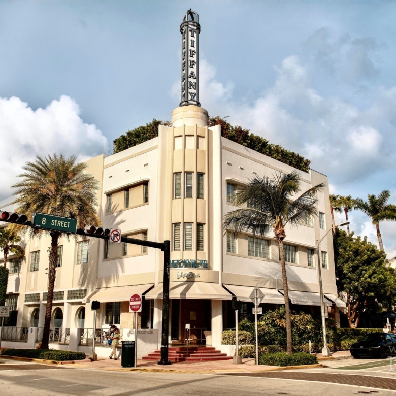 Historic Art Deco streetscape on Collins Avenue following a South Beach hotel sale.