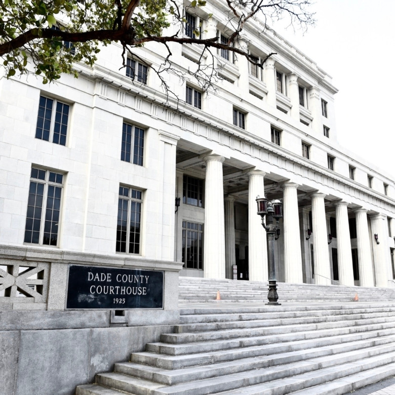 The iconic historic Miami commercial property at 73 W. Flagler Street, highlighting its classical revival architecture.